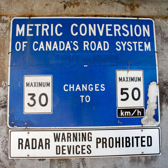 sign announcing metric conversion of Canada's road system, September, 1977